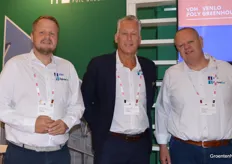 Johan and Henk van Tuijl flank Eric van der Klauw in the booth of VDH and AgrowSer